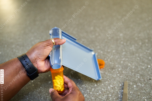 Black pharmacist prepare medication for hospital patient