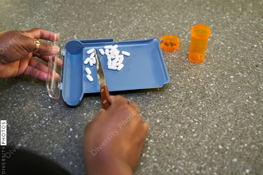 Black pharmacist prepare medication for hospital patient