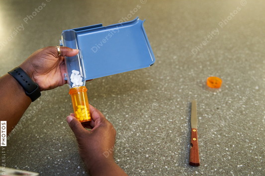 Black pharmacist prepare medication for hospital patient