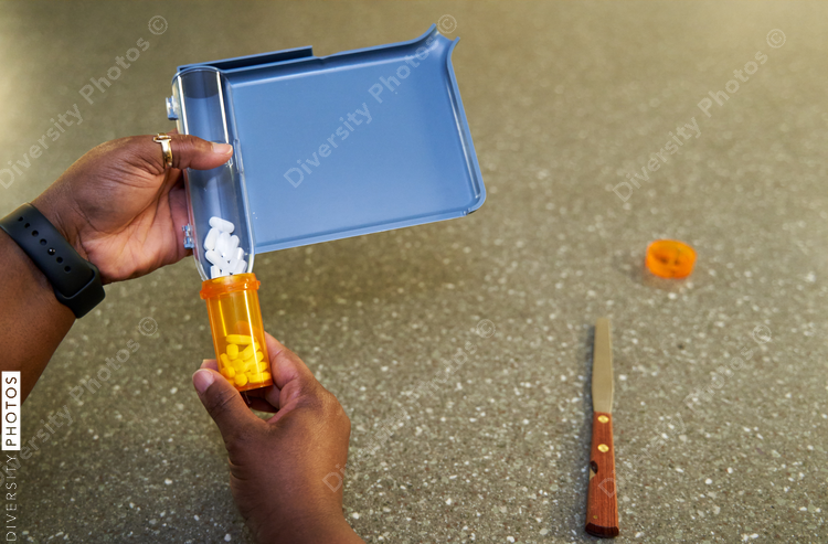 Black pharmacist prepare medication for hospital patient