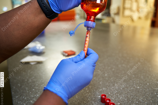 Black pharmacist prepare medication for hospital patient