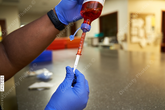 Black pharmacist prepare medication for hospital patient
