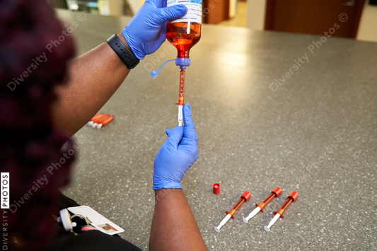 Black pharmacist prepare medication for hospital patient