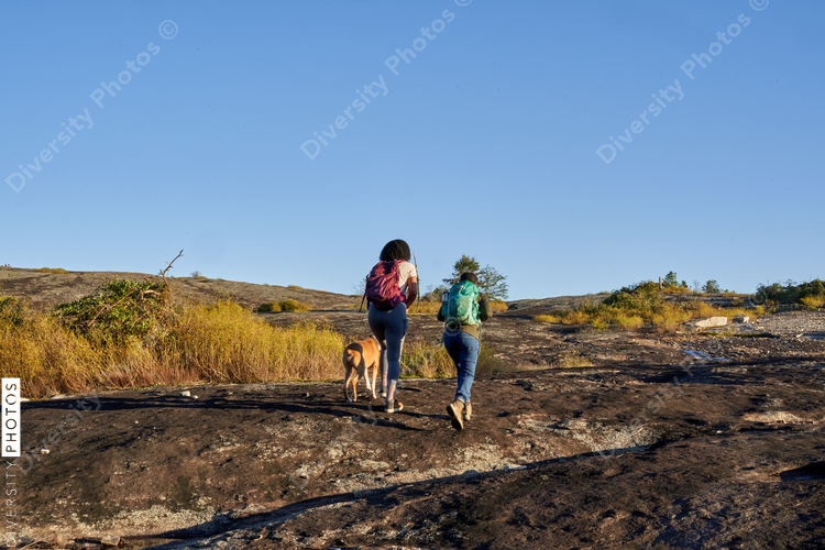 Diverse group of friends hiking Arabia Mountain in USA