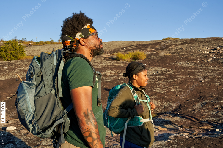 Diverse group of friends hiking Arabia Mountain in USA
