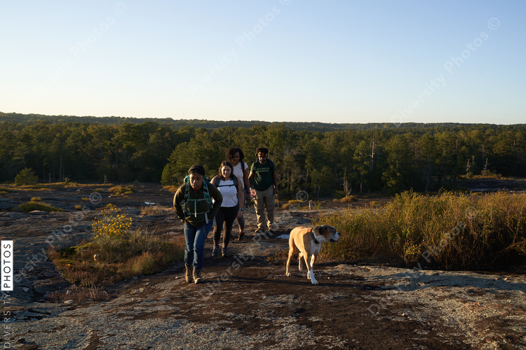 Diverse group of friends hiking Arabia Mountain in USA