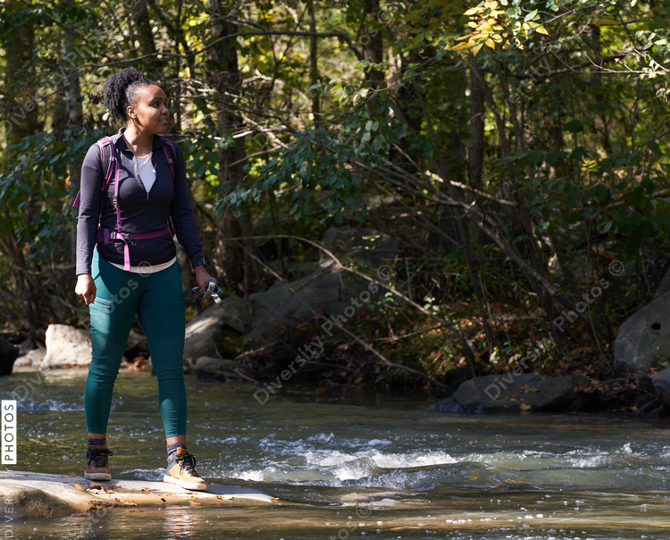 Portrait of black female hiker trekking