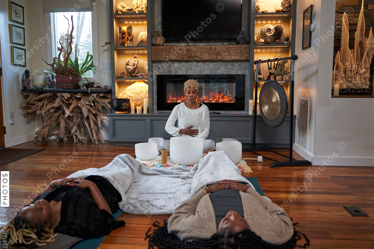 Black women enjoy peaceful sound bath meditation