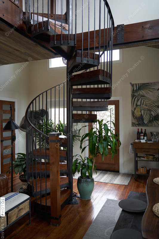 Beautiful interior home, warm and cozy earth tones, spiral staircase