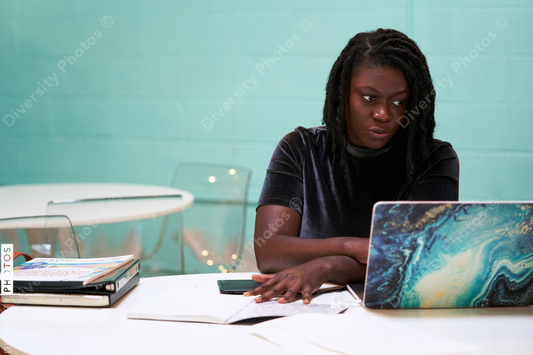 Black graphic design artist creative working on school project, on laptop