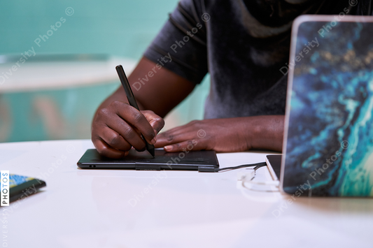 Black graphic design artist creative working on school project, on laptop