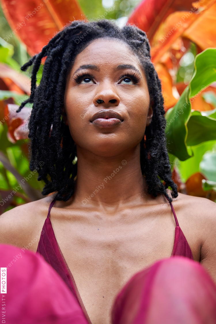 Portrait of young Black woman in garden, plants and nature