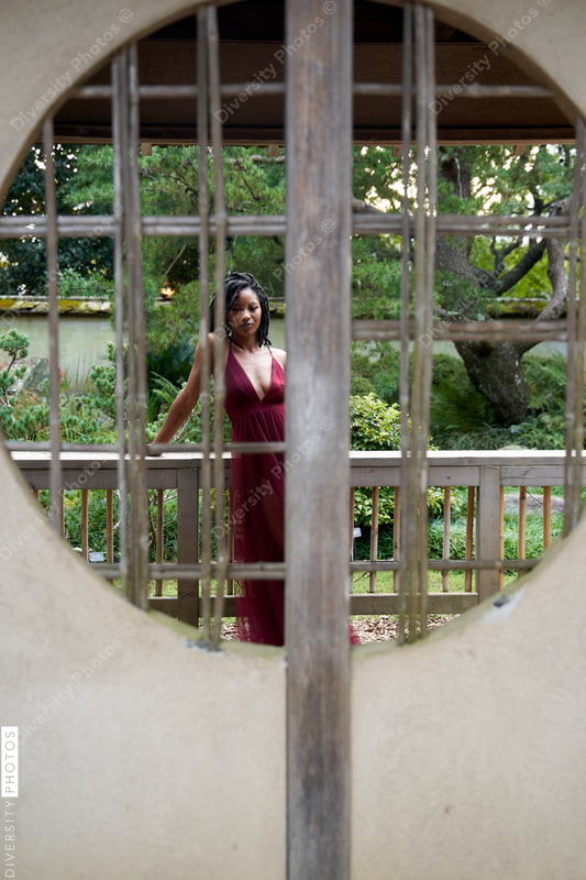 Black woman behind the wall, with copy-space