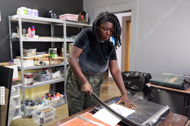 Black woman using cutting board, artist DIY project