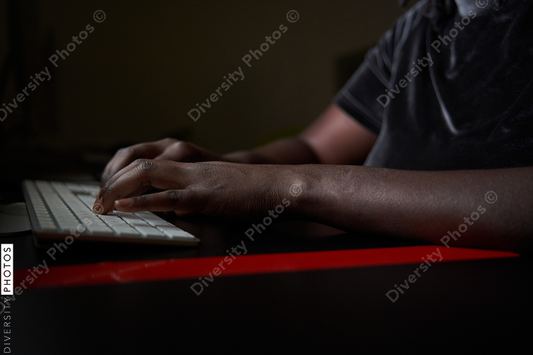 Black woman college student studying in computer lab