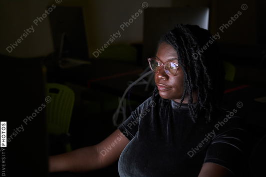 Black woman college student studying in computer lab