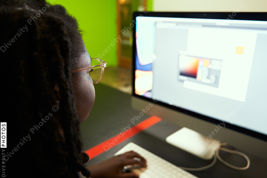 Black woman college student studying in computer lab