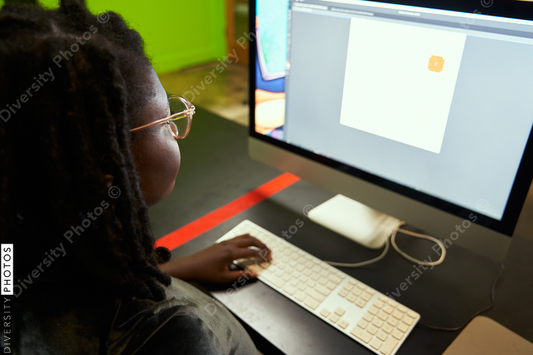 Black woman college student studying in computer lab