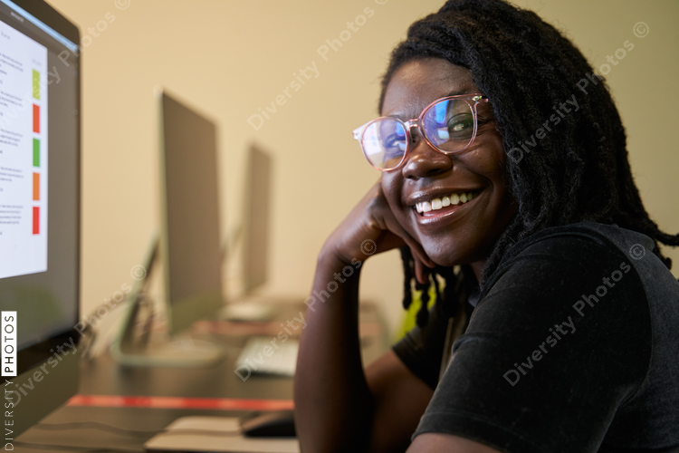 Black woman college student studying in computer lab