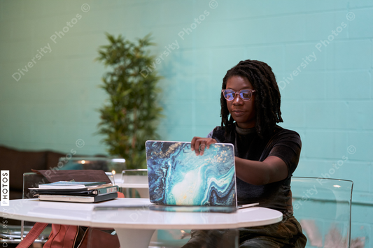 Black graphic design artist creative working on school project, on laptop