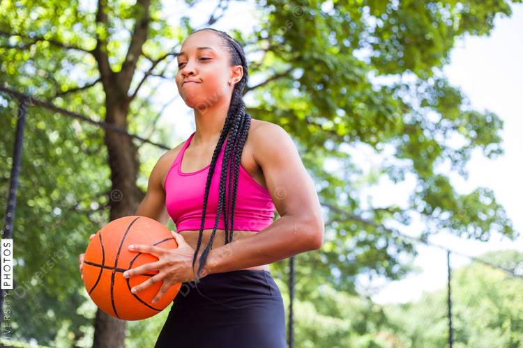 Low angle view of woman playing basketball