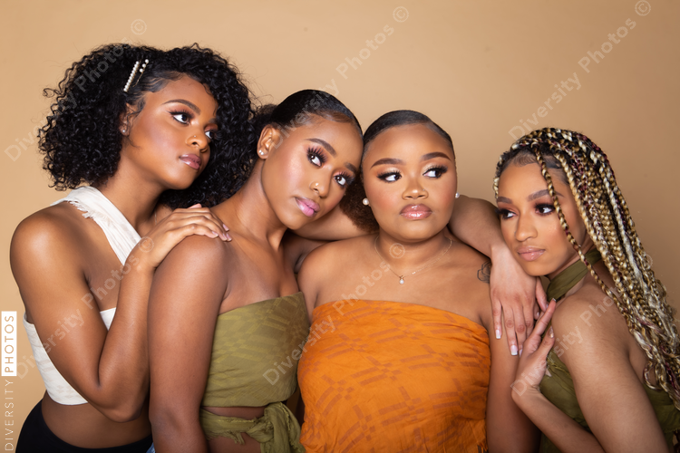 Studio portrait of four beautiful black female friends