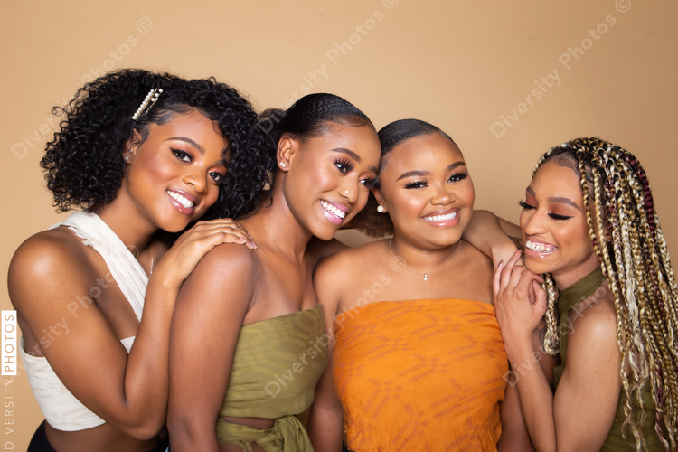 Studio portrait of four beautiful black female friends