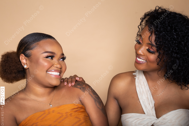 Female happy best friends studio portrait