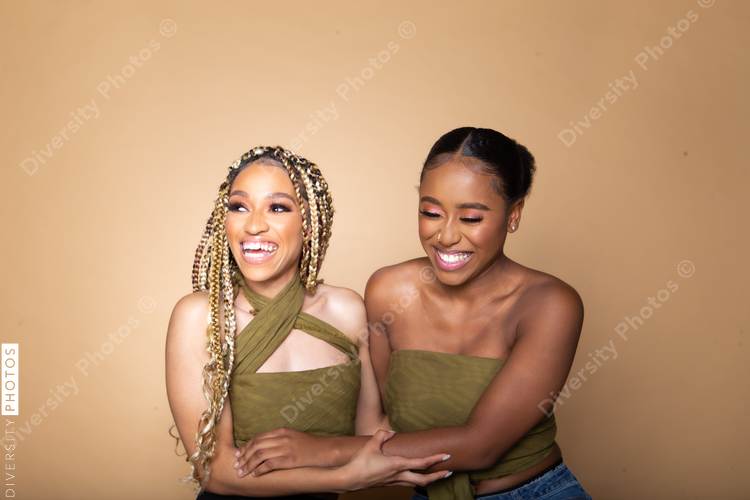 Female happy best friends studio portrait