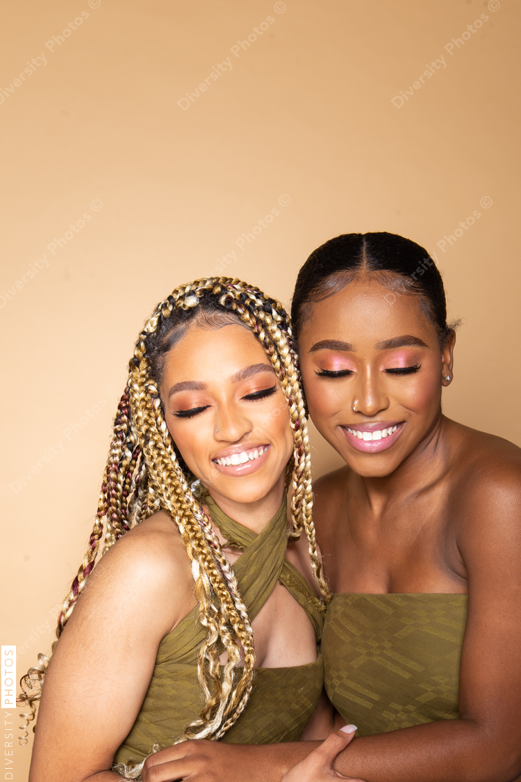 Female happy best friends studio portrait
