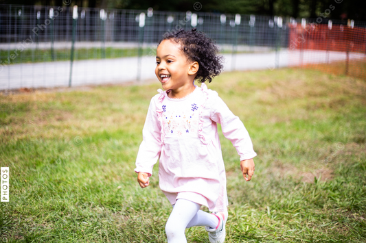 Young toddler running and enjoys the outdoors