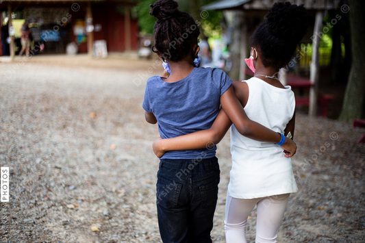 Best friends walking on family farm