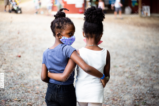 Best friends walking on family farm