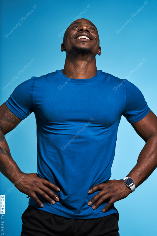 Athletic man looking up with copy-space