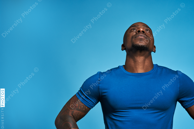 Athletic man looking up with copy-space