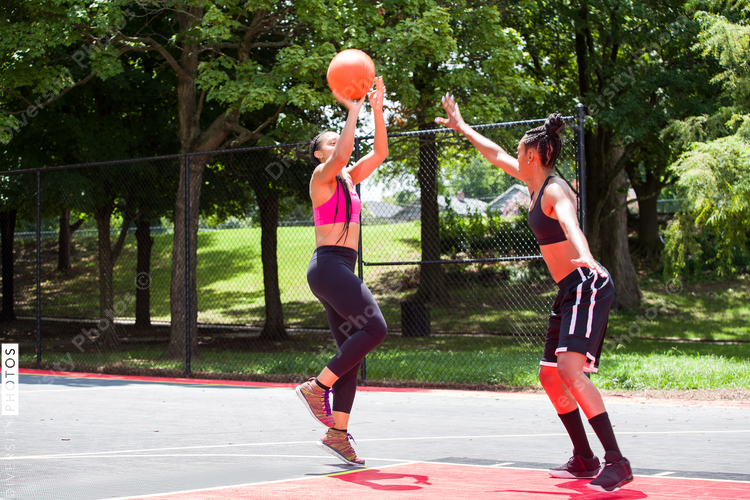 Women playing with basketball
