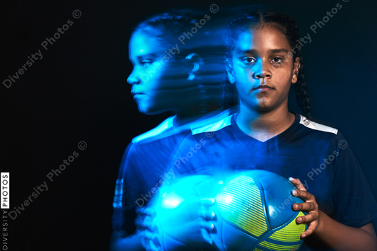 Young female soccer player in motion colorful portrait