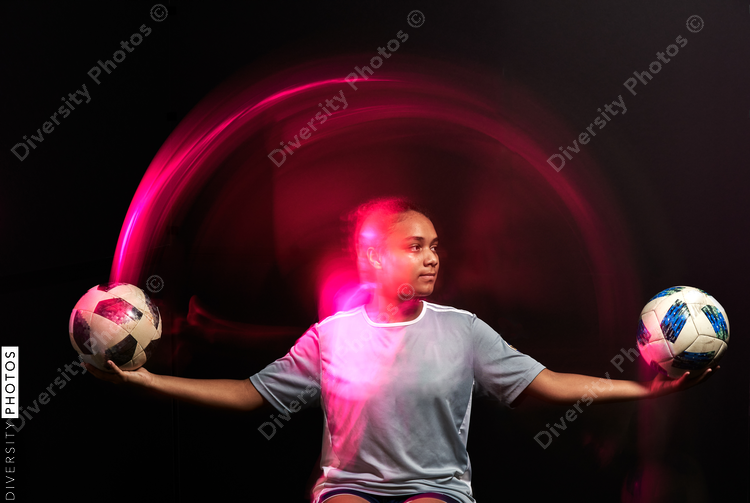 Young female soccer player in motion colorful portrait