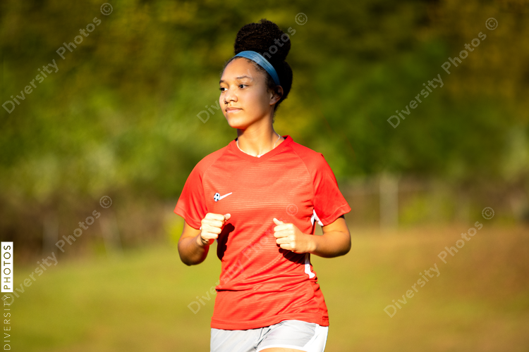 Teenage girl soccer player outdoors