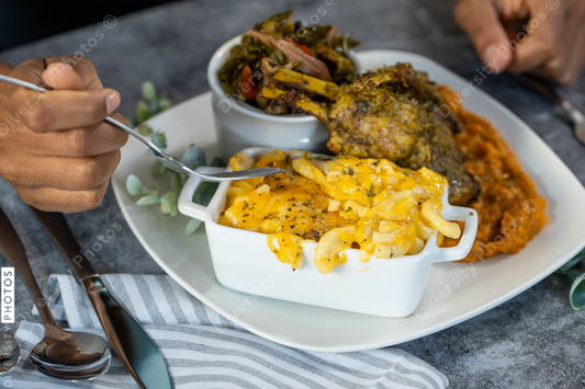 Black hands eating southern cooked soul food