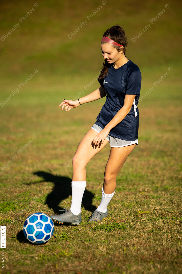 Soccer player running after ball