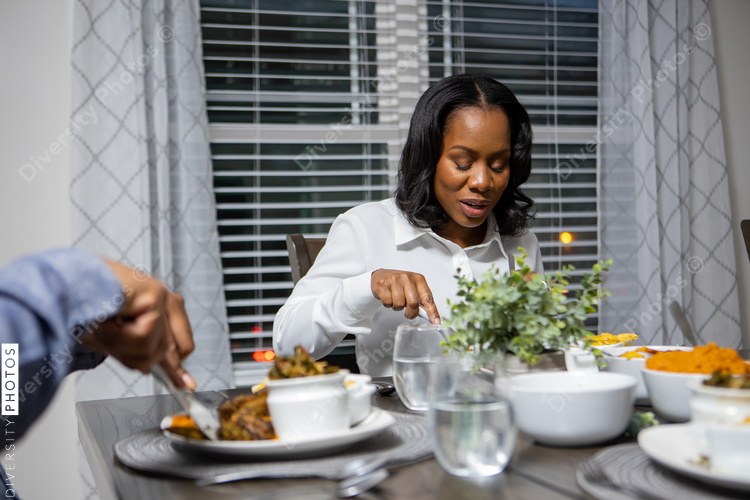 Family eats food at dinner table, home connected togetherness