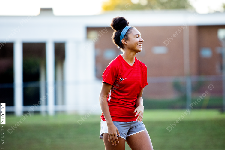 Happy young female soccer player