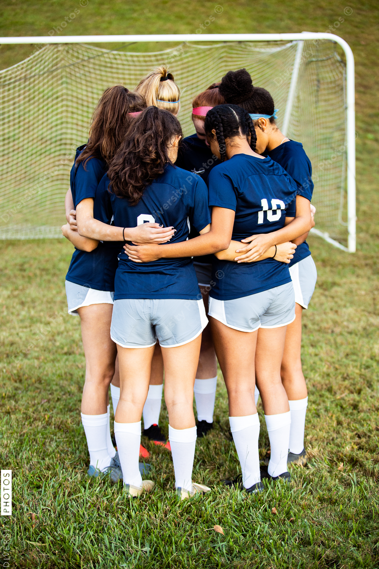 Female team huddled together before game