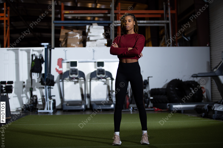 Young Black female athlete in gym