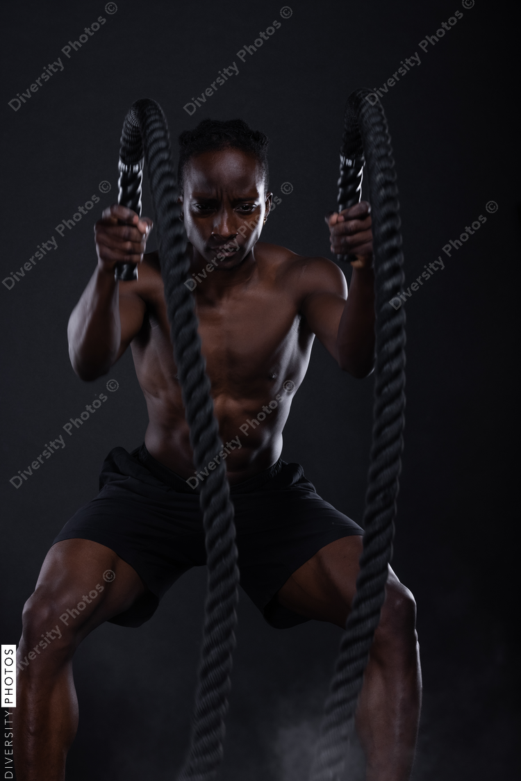 African American man doing intense sports training, exercises 