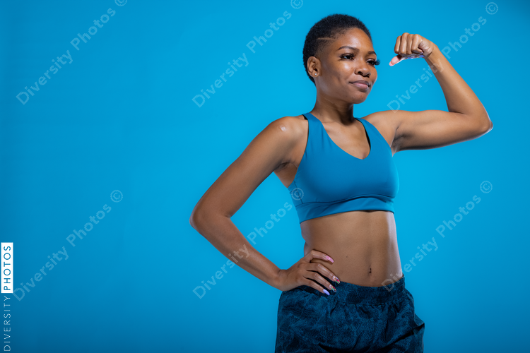 Portrait of fit African American woman in fitness wear with copy-space