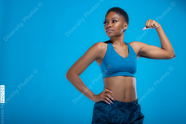 Portrait of fit African American woman in fitness wear with copy-space