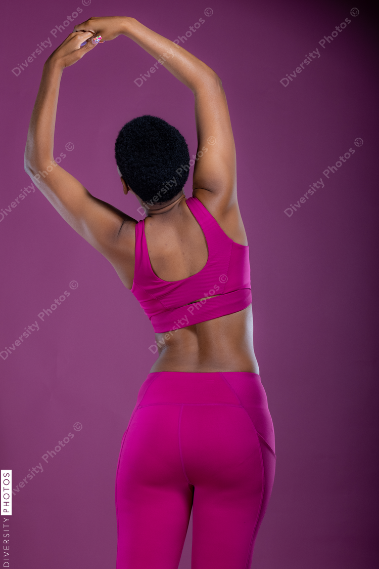 Black woman stretching arms and back, fitness, wellness 