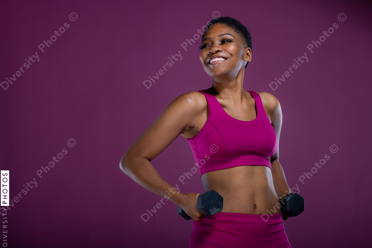 Black woman workout with dumbbells and copy-space